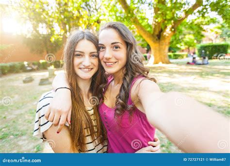 two girls taking a selfie together at park stock image image of love park 72727121