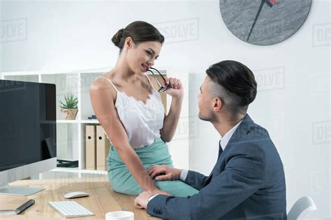 Babe Sexy Secretary Seducing Her Boss At Workplace In Office Stock Photo Dissolve