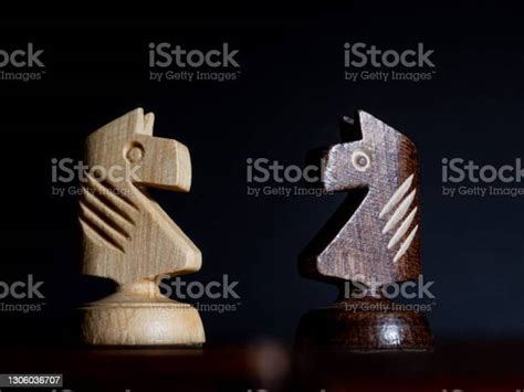 White And Black Chess Knights Facing Each Other Stock Photo Download