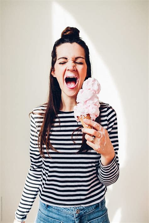 Girl Holding Ice Cream Cone Del Colaborador De Stocksy Pink House