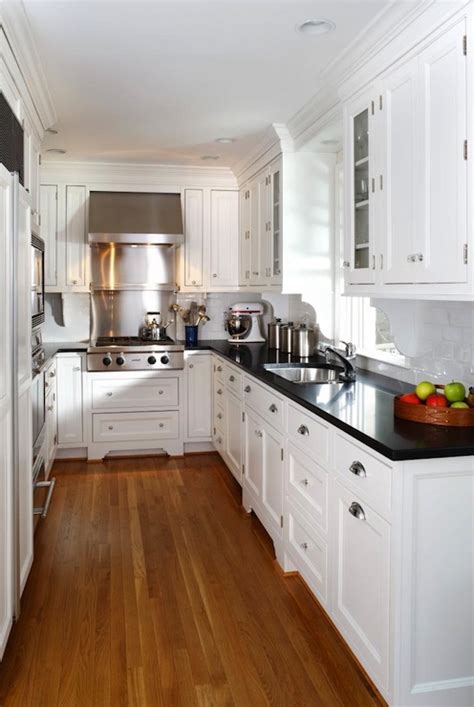 White Kitchen Cabinets With Black Countertops Traditional Kitchen
