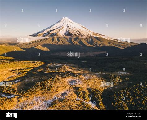 Mount Taranaki Volcano After The First Snowfall Of The Season At Sunset