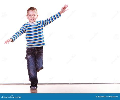 Little Boy Have Fun Alone At Home Stand On One Leg Stock Photo Image