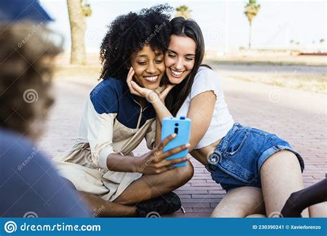 Happy Multiracial Women Friends Taking A Selfie With Smart Phone Outdoors Stock Image Image Of