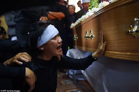 People Crying At A Funeral