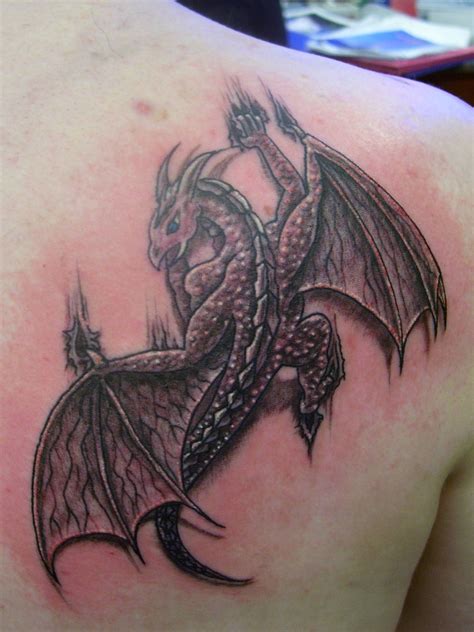 Black Ink Dragon Tattoo On Man Right Back Shoulder Dragon Tattoo Designs Dragon Tattoos For