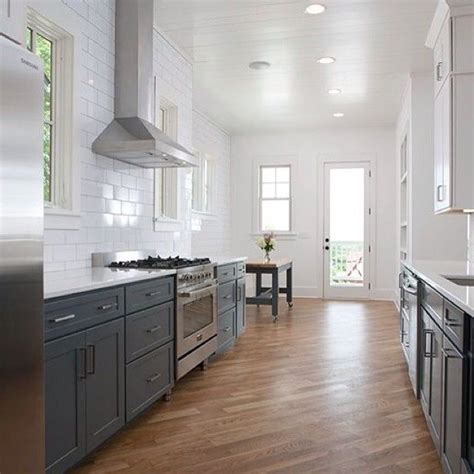 If you're refinishing oak but want a more contemporary whether you opt for oak, maple, or walnut, you can leave your hardwood floors au naturel in a kitchen with gray cabinets. Whitewashed Wood Floors: Yes or No? | Gather & BuildGather ...