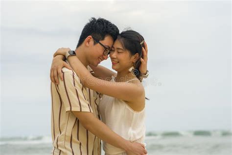 Sweet And Romantic Lifestyle Portrait Of Young Happy Asian Chinese Couple In Love Enjoying
