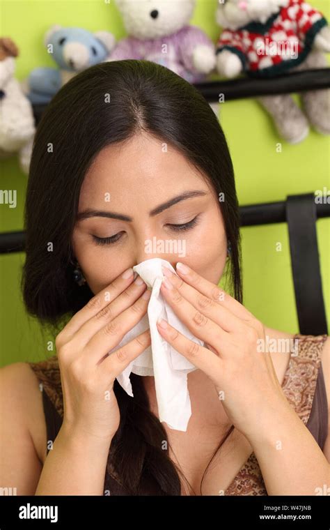 Woman Blowing Nose With Tissue Paper Stock Photo Alamy