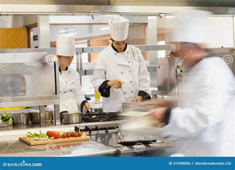 Busy Chefs At Work In The Kitchen Royalty Free Stock Image Image