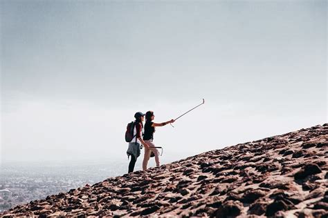 Two Caucasian Female Hikers Wearing Taking Selfie Cobblestone