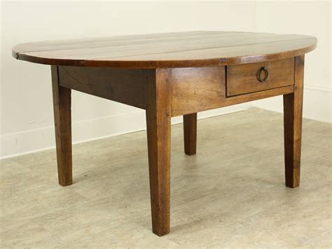 Sitting around the abaco coffee table is the best spot to share all your stories with your friends and family. Antique Oval Cherry Coffee Table at 1stdibs