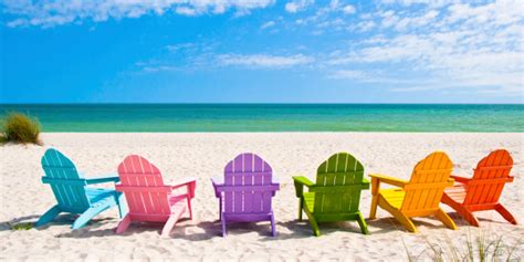Adirondack Beach Chairs On A Sunny Vacation Beach Stock Photo