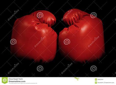 Vintage Boxing Gloves Emerging From Black Background Stock Image