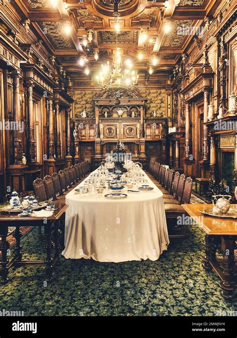 A Vertical Shot Of An Interior Of A Dining Room In The Peles Castle In