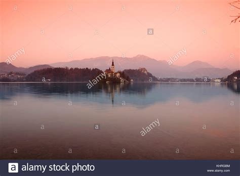 View Of Lake Bled And The Church Of Mary The Queen Located On A Small