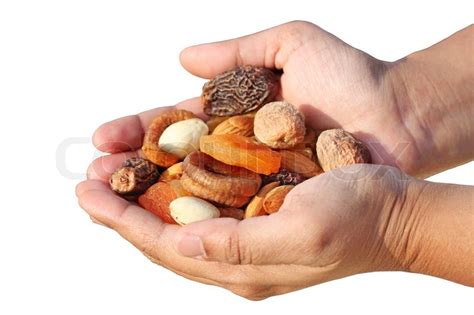Bunch Of Dry Fruits In A Womans Hand Stock Photo