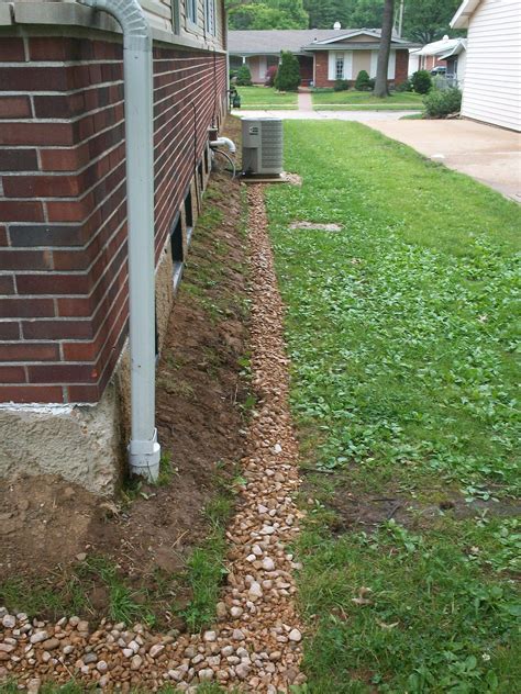 French Drain And Downspout Extensions Divert Rainwater Safely Away