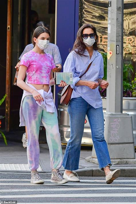 katie holmes sports a button down with jeans while on a walk with suri cruise in new york city
