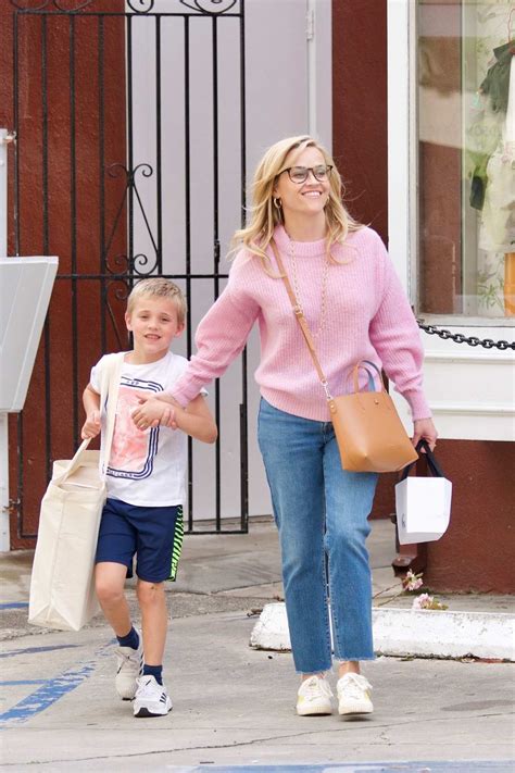 reese witherspoon is all smiles as she steps out with her son at brentwood country mart in los