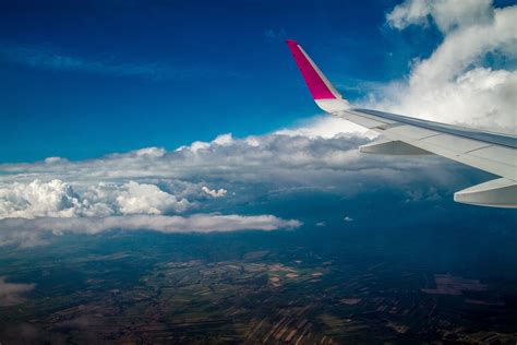 Aerial View Of Airplane Wing Above Clouds Hd Wallpaper Wallpaper Flare