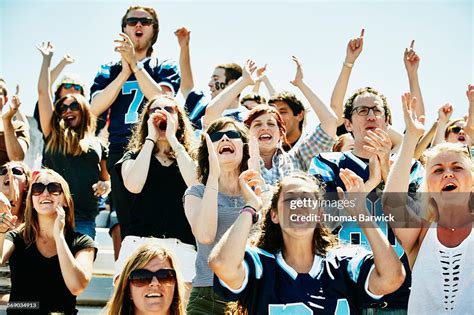Crowd Of Football Fans Cheering In Stadium High Res Stock Photo Getty