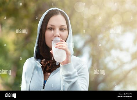 Beautiful Woman Enjoys Drinking Water During Exercise Stock Photo Alamy
