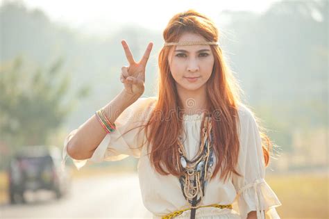 Hippie Girl With Peace Signs Royalty Free Stock Images