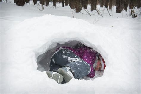 Girl Laying In Snow Tunnel On Winter Day Stock Image Image Of
