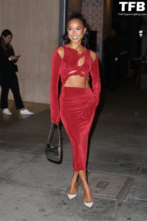 karrueche tran shows her pokies in a red dress at the hollywood reporter s oscar nominees night