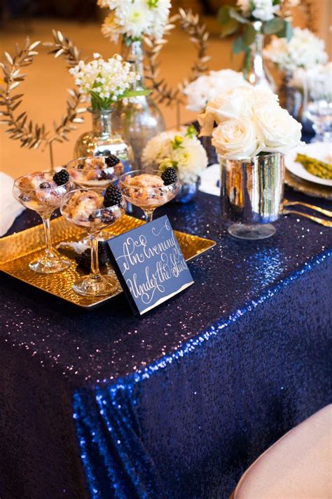 This arrangement uses roses, dahlias, wax flowers, stock, silver dollar eucalyptus, and red amaranthus to create a cascading shape. Pin on Midnight Blue Wedding Colors