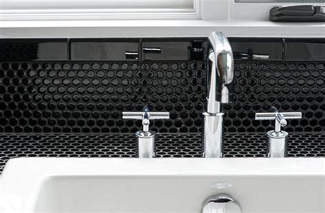 A blue penny tile bathroom backsplash paired with wallpaper of the same shade establishes a polished look without the trouble of installing a full wall of. Bathroom with Black Penny Tiles - Contemporary - Bathroom
