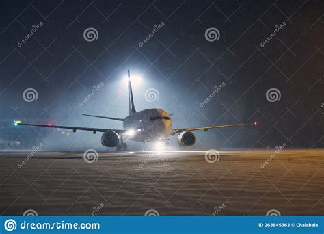 Airplane Taxiing At Airport During Heavy Snowfall Stock Image Image