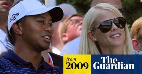 tiger woods rescued from crash by wife elin nordegren carrying a golf club tiger woods the
