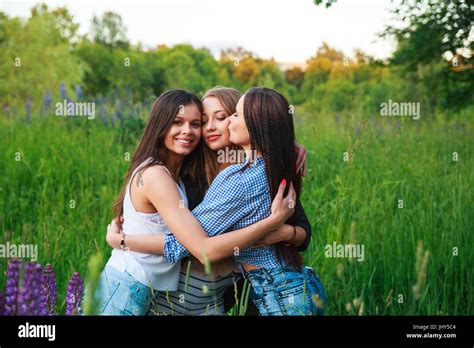 Girlfriends Friendship Happiness Community Concept Three Smiling Friends Hugging Outdoors In