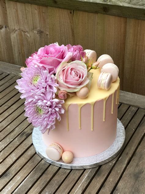 pink buttercream drip with fresh flowers and macarons fresh flower cake pretty cakes flower