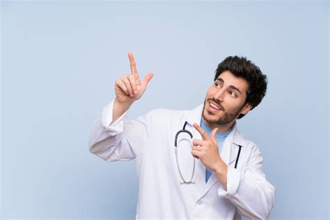 Premium Photo Doctor Man Pointing With The Index Finger A Great Idea
