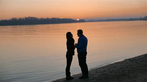 Slowmotion Couple Embracing At Sunset Silhouettes Of Men And Women On