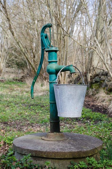 Old Hand Water Pump With A Bucket Stock Photo Image Of Decorative