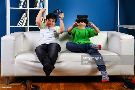 Two Boys Playing Games High Res Stock Photo Getty Images