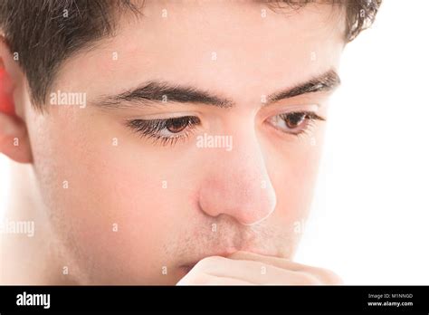 Extreme Closeup Of Thoughtful Teenage Boy Isolated On White Background