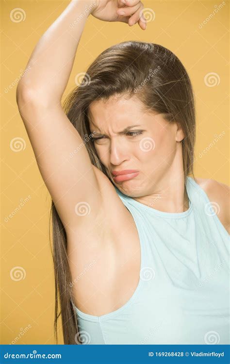 Young Woman Smells Her Armpit Stock Photo Image Of Sweating Odor