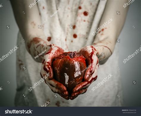 Bloody Halloween Theme: Crazy Killer Keeps Bloody Hands Torn Bloody Human Heart And Experiencing 