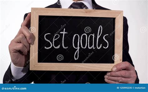 Set Goals Motivation Written On Blackboard In Businessman Hands
