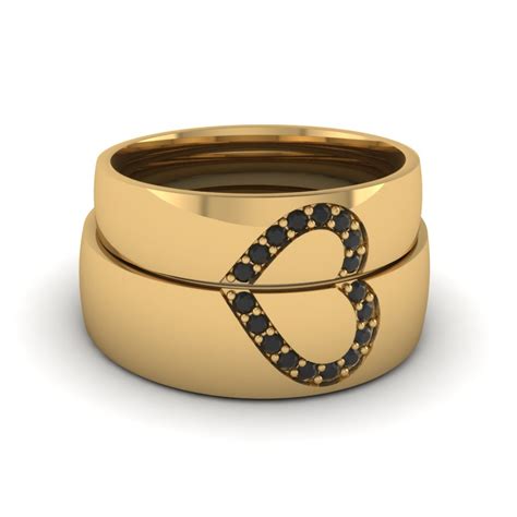 When matching your rings, the metals may be the same or you can mix gold tones in the engagement ring and wedding band. Wedding Band Sets His And Hers With Black Diamond In 14K Yellow Gold | Fascinating Diamonds