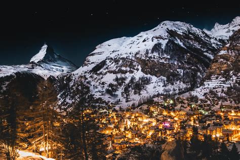 Zermatt Switzerland Lit Up At Night With The Matterhorn In The