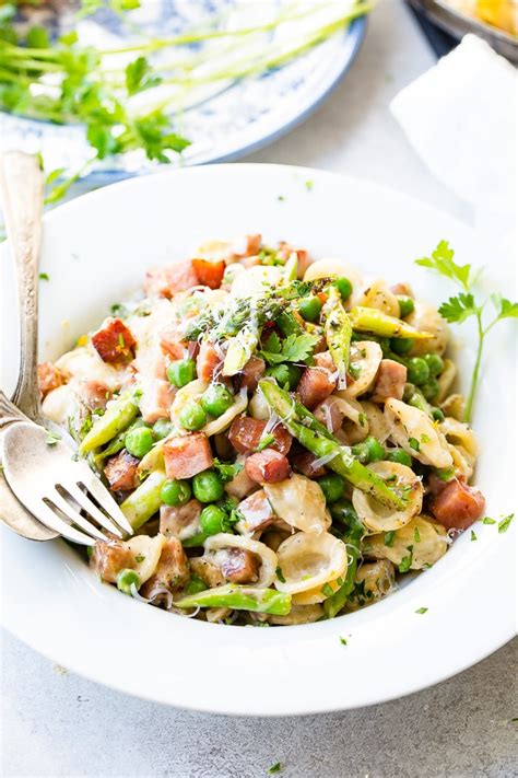 More+ less cook and drain pasta as directed on package, adding peas during last 2 to 3 minutes of cooking time. Spring Ham and Asparagus Lemon Cream Pasta - Oh Sweet Basil