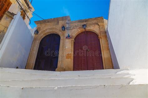 Ancient Greek Architecture With Traditional Doors And Decorative