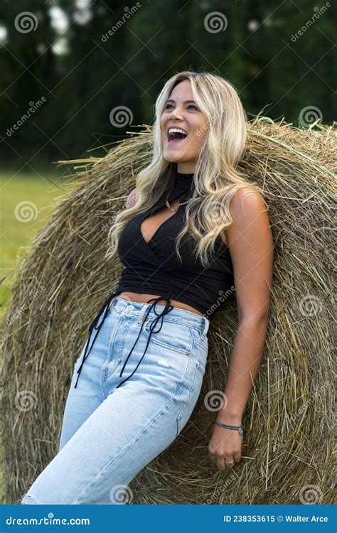 a lovely blonde model poses outdoors in a farm environment stock image image of environment