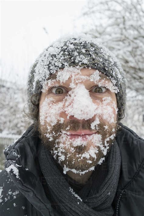 Portrait Of Man With Snow In His Face Stock Photo